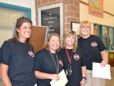 staff greeting students for open house