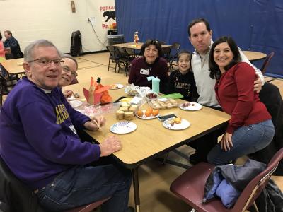 families enjoying thanksgiving lunch