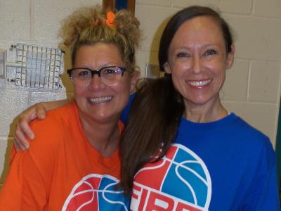 two teachers play on opposite fire and ice teams